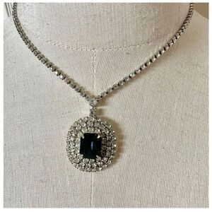 Silver tone rhinestone and blue pendant necklace